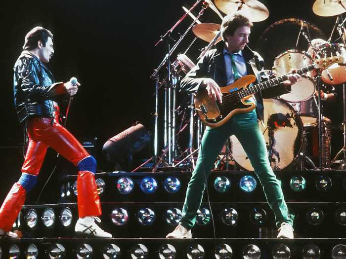 1980: Freddie Mercury and John Deacon share the spotlight.