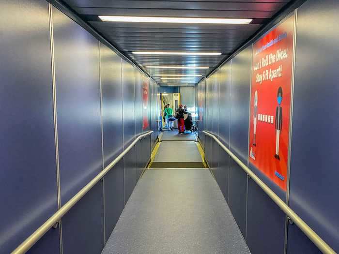 The jetway similarly featured social distancing reminders installed by the airport and not Frontier.