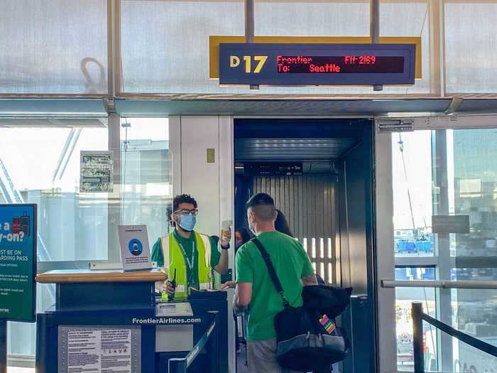 And before anybody could step foot on the plane, their temperature was checked. Flyers with a temperature of 100.4 degrees Fahrenheit or greater would be denied boarding. Frontier is the only major US airline doing this.