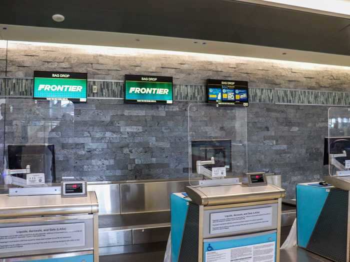 The airport also installed plexiglass partitions at each check-in counter.