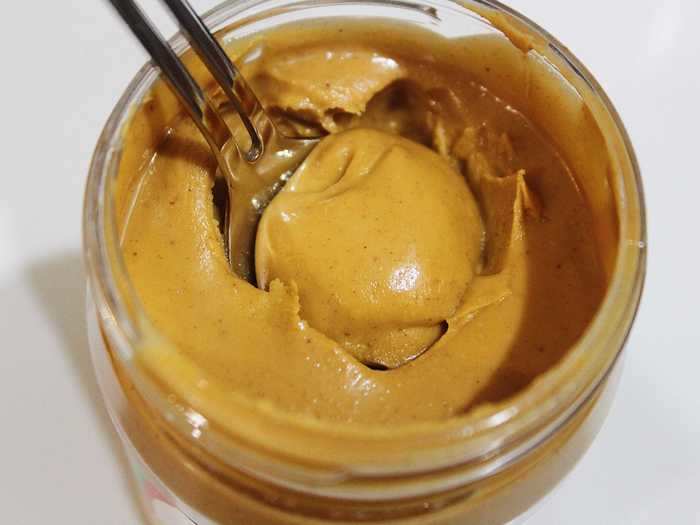 Natural peanut butter is OK for dogs.