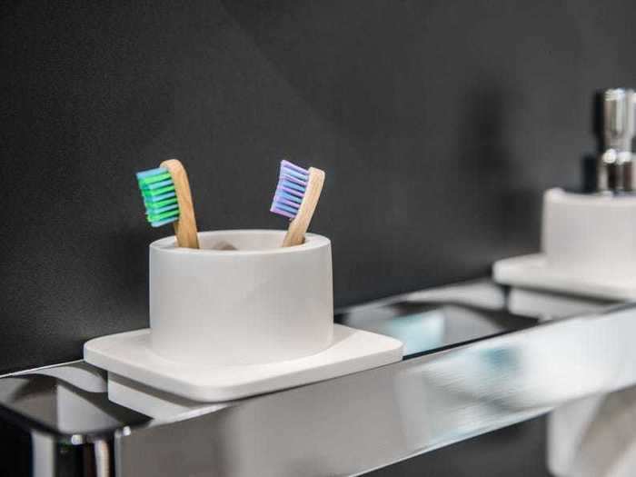 Rinsing your toothbrush with plain water may leave bacteria behind.