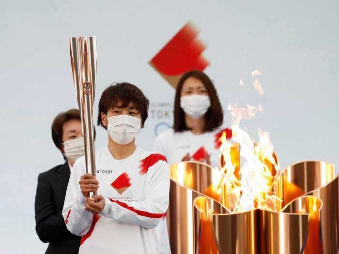 The Tokyo Olympic torch relay began on Thursday with a quiet opening ceremony.