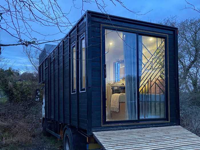 Tall windows and a set of glass double doors were added to the home to let natural light in.