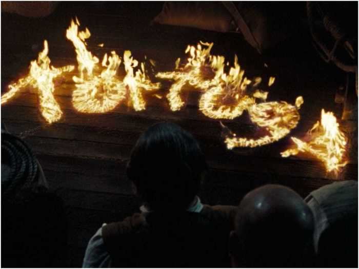Elizabeth Swann uses fire to write the word 