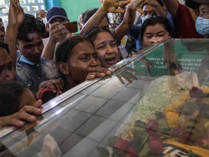 In Yangon, relatives mourn the death of a 13-year-old boy at the hands of the junta.