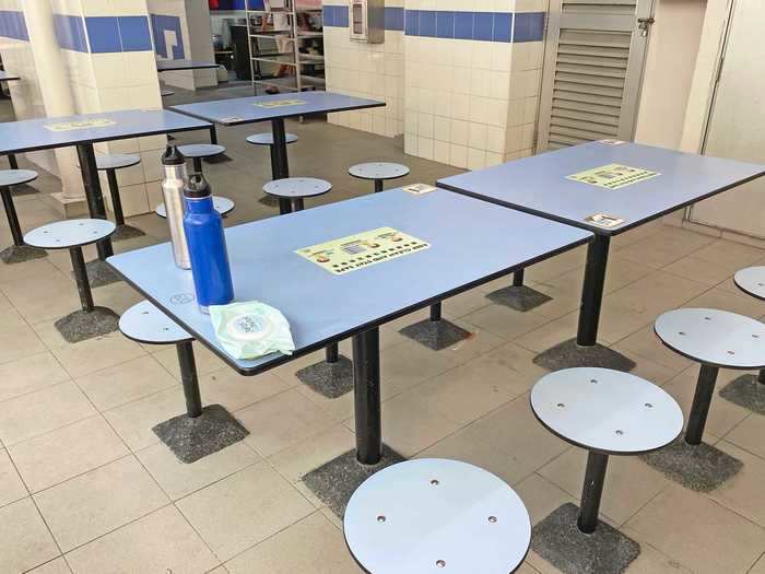 You can sit wherever you like in the hawker center, but you should be aware of Singapore