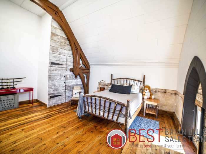 On the other side of the home, a staircase leads to another upstairs area with more bedrooms.