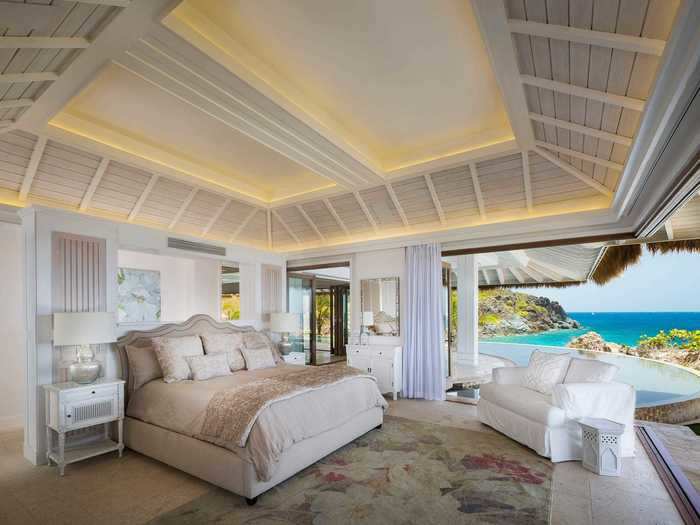 The pool is directly accessible from the master suite, which has walls that open up for 180-degree sea views, a private sundeck, and an outdoor bathtub.