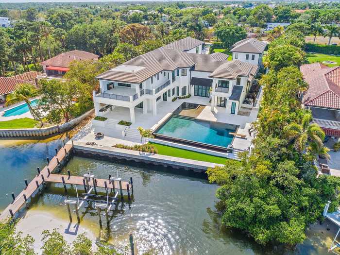 The outside also has an inground, saltwater pool.