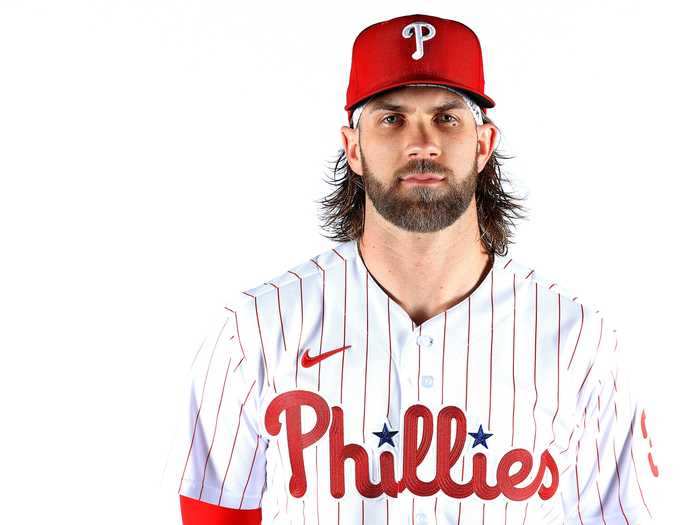 The Phillies jersey still features the same logo and is once again set on a pinstripe background.