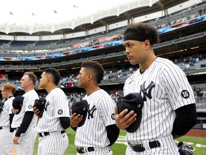 Today, the uniform still features the pinstripes, but there are added adornments too.