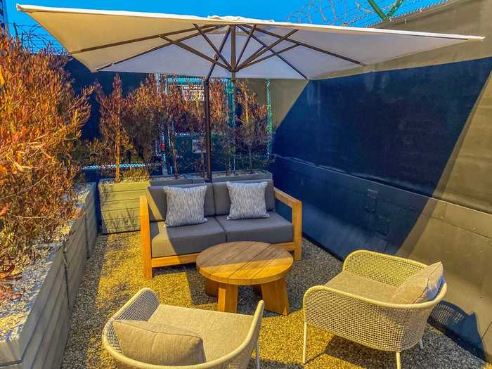 Directly adjacent to the suite is an outdoor patio with benches and chairs to enjoy a bit of the outdoors before heading off on a plane for however many hours.