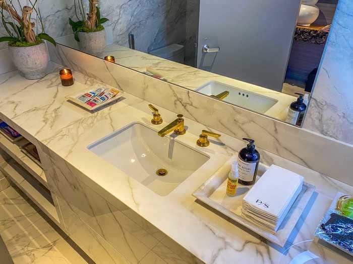 The luxury continued into the restroom complete with marble floors and vanities, as well as gold-plated sink faucets.