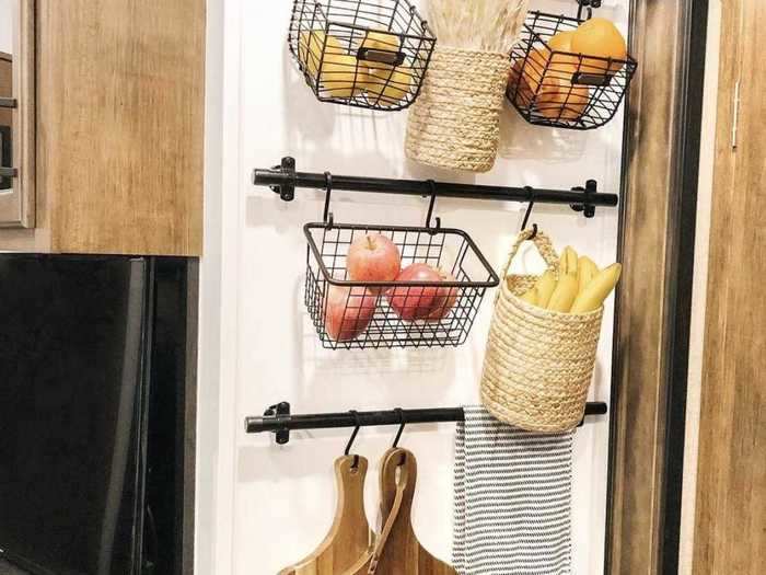 To save counter space, Libby created a hanging produce pantry on the wall of her kitchen.