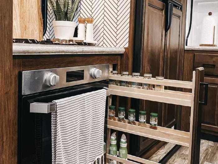 Also in the kitchen, Libby transformed a narrow cabinet into a pull-out spice rack.