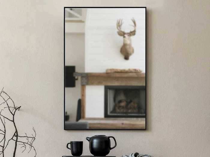 Hang this on-trend, iron-framed mirror anywhere in your house.