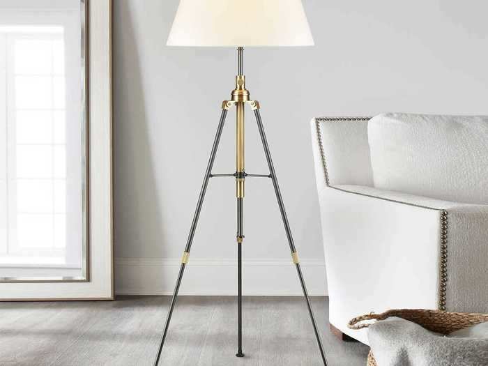 Give the corners of a room more visual interest with this tripod floor lamp.