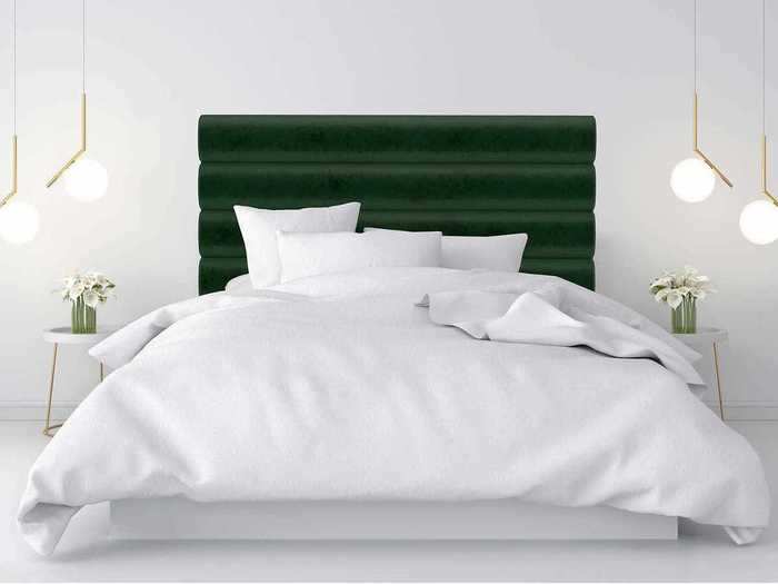 Give your bedroom some geometric lines with this stunning emerald-green headboard.