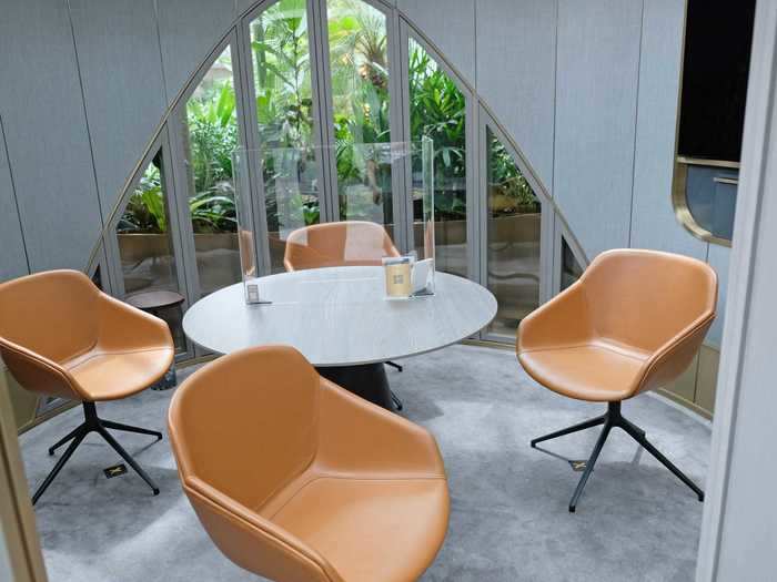 Each pod is set up with a round table, four chairs, and a screen where a relationship manager can advise the client using a larger screen instead of a laptop or tablet.