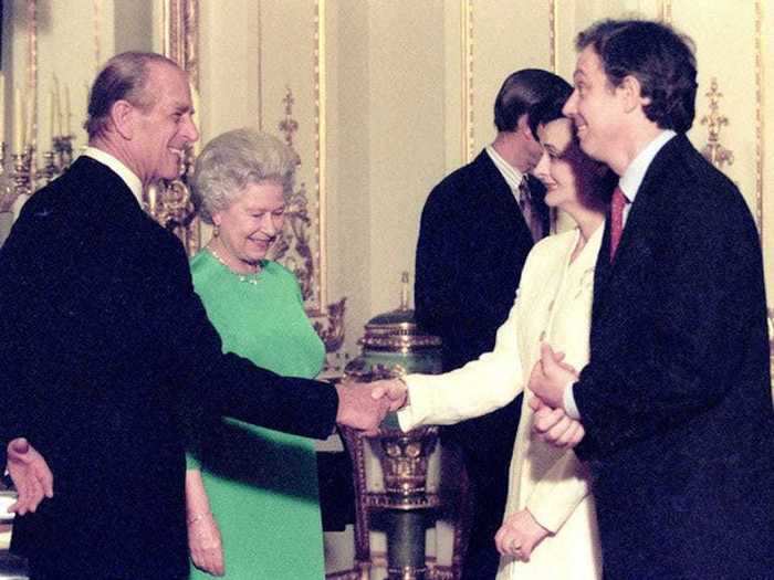 1998: Queen Elizabeth and Prince Philip greet Tony Blair and his wife Cherie at Buckingham Palace in London on the second day of the Asia-Europe meeting.