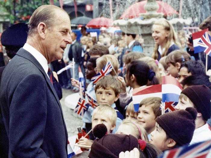 1988: Prince Philip was greeted by children of the British School in Holland.