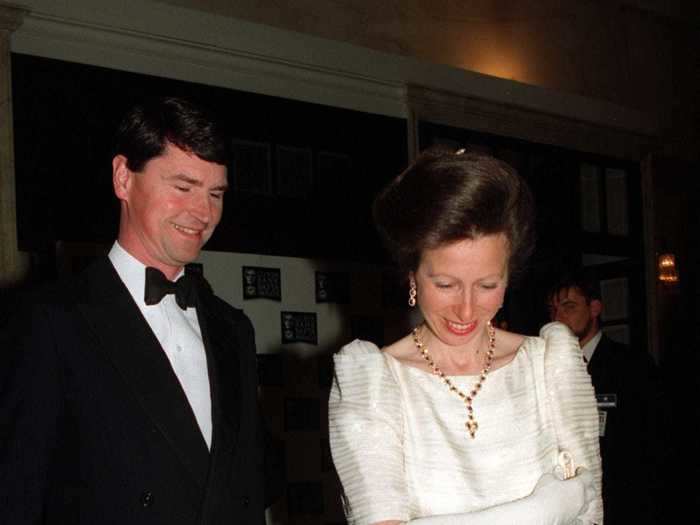 Anne wore an iridescent white striped dress with puffed sleeves, paired with gloves and gold jewelry, in 1994.