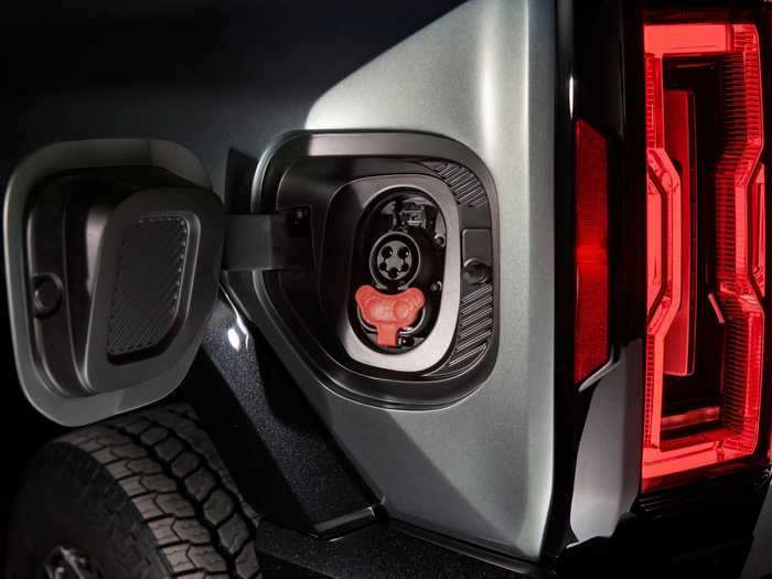 An available "power station" lets drivers use their Hummer to power appliances and tools or "jump charge" another EV.