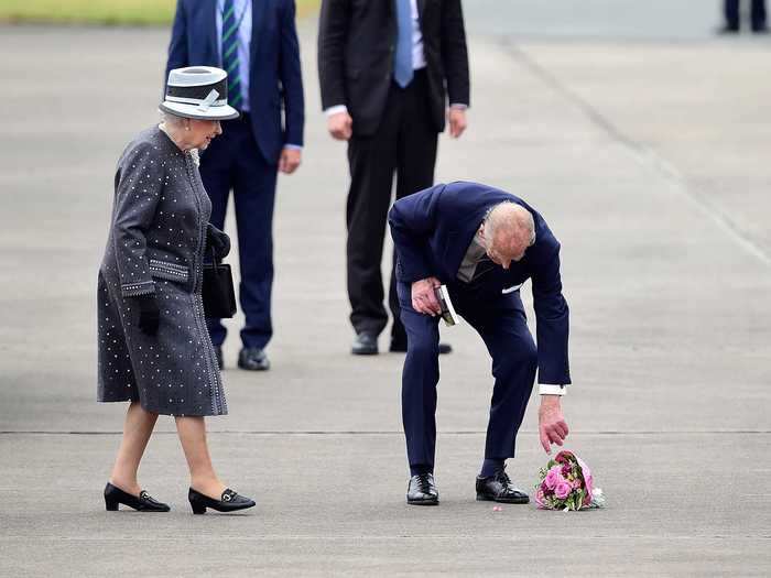 In a candid moment in Germany in 2015, Prince Philip picked up a bouquet of flowers he