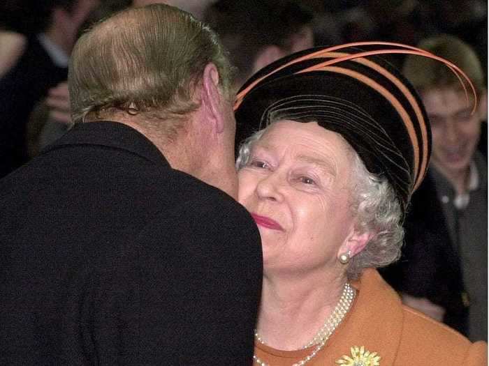 In a rare public display of affection, Prince Philip kissed Queen Elizabeth on the cheek on New Year