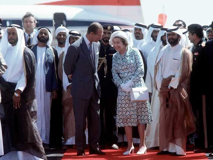 Queen Elizabeth grinned as she leaned in to chat with Prince Philip on a visit to Abu Dhabi in 1979.