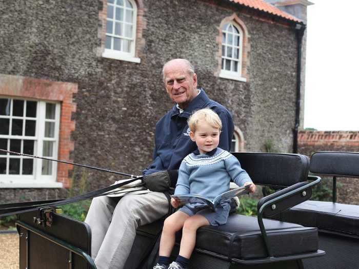 Prince William and Kate Middleton shared a never-before-seen photo of Philip with Prince George following his death.