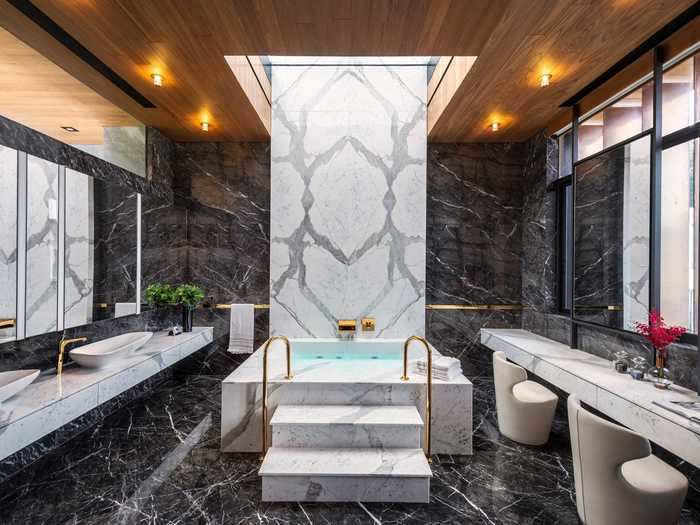 Photos of the home show lavish marble bathrooms. There