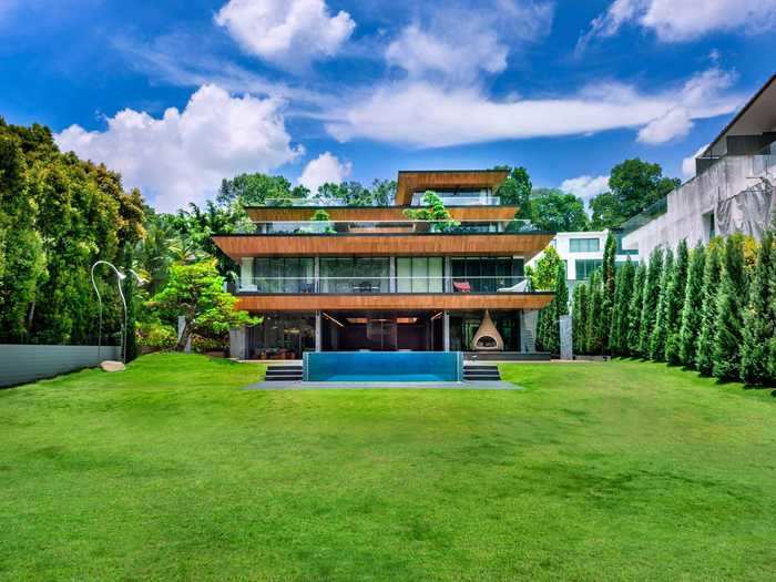 The back of the home shows off the modern addition that was designed as "as a series of stepped terraces with green roofs," according to the architecture firm.