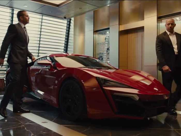 Brian and Dom crash a $3 million Lykan Hypersport through two buildings in "Furious 7."