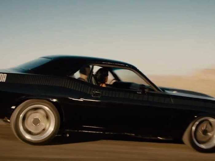 Dom drives Letty to Race Wars in a black 1970 Plymouth Barracuda.