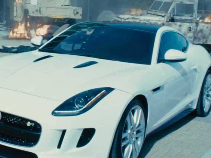 Deckard Shaw (Jason Statham) strolls out of the hospital he single-handedly destroyed at the beginning of "Furious 7" in a white Jaguar F-Type.