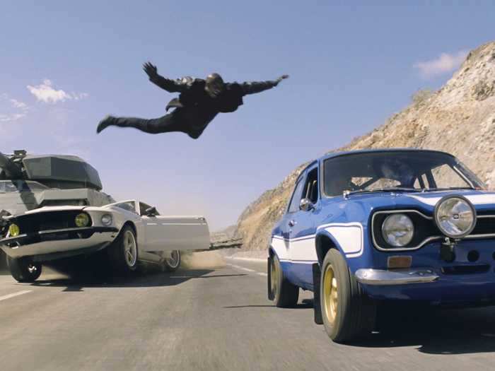 Roman jumps atop the 1970 Ford Escort MK I RS1600 to save his life.