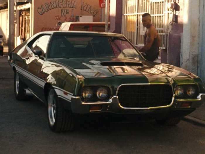 The car Dom is searching for in "Fast & Furious" is a green 1972 Ford Gran Torino Sport.