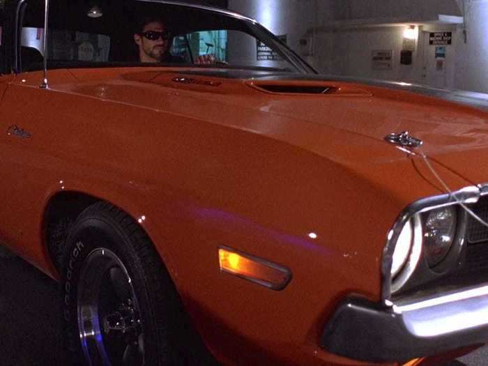 Always one for flashy colors, Roman wins a bright orange Dodge Challenger R/T in a street race.