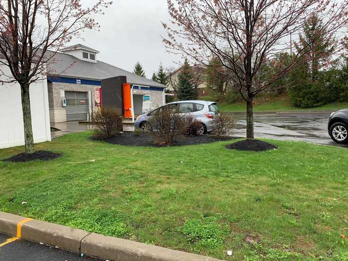 This location has a typical drive-thru setup, with a menu board and speaker where customers can order.