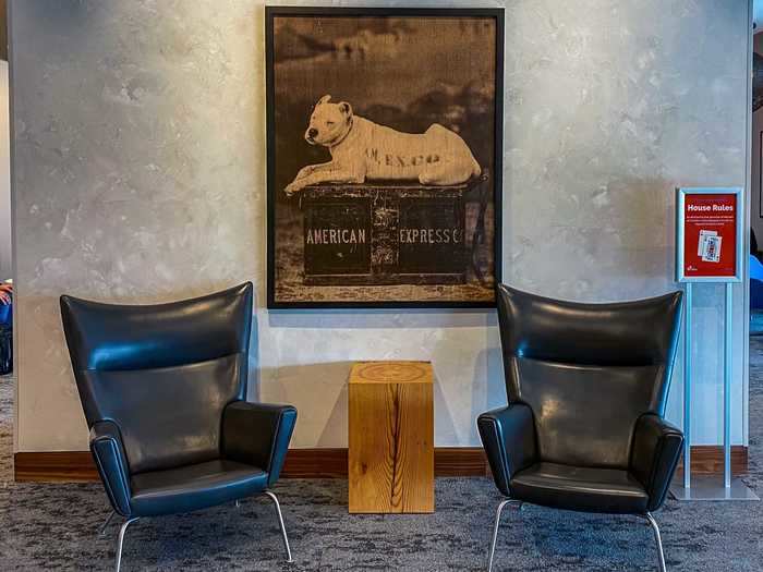 Within seconds, I was inside one of the most exclusive clubs in Las Vegas. Greeting me was this portrait of a dog resting on an American Express trunk accompanying two black armchairs, a staple of the Centurion Lounge that can be found in every location.