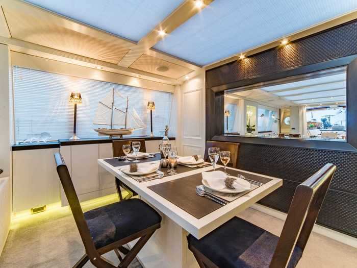 A window opens it up to the nautical-themed dining area.