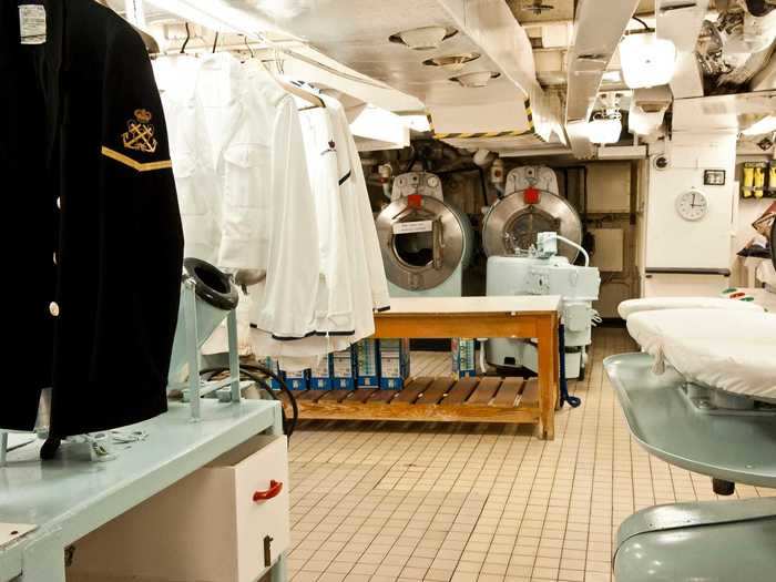 Towards the front of the ship are the rooms where the staff lived and operated, like the 24-hour laundry room. Here, yachtsmen and officers would change outfits up to six times per day.