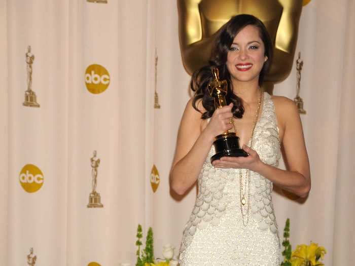 2008: Marion Cotillard accepted her Academy Award in a memorable white gown.