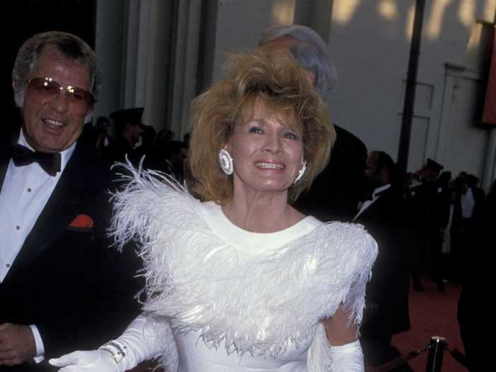 1989: Angie Dickinson made a daring choice with this all-white feathered ensemble.