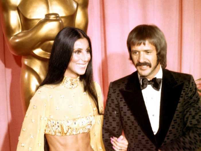 1973: Cher bared her abs in this yellow two-piece.