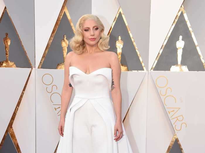 In 2016, Lady Gaga wore a white jumpsuit by Brandon Maxwell with a flowing train at the back.