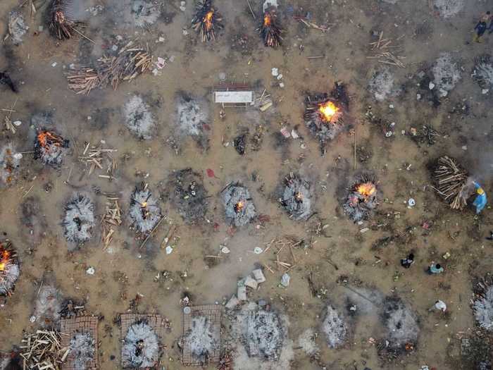 As the crematoriums are overrun, people are turning t mass burials in makeshift facilities like parking lots.