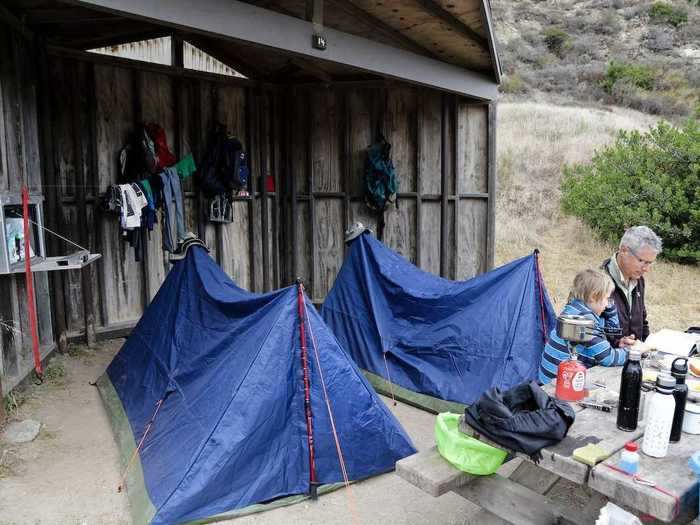 The Water Canyon campsite on Santa Rosa Island gets windy, so campers set up their camps in wind shelters.